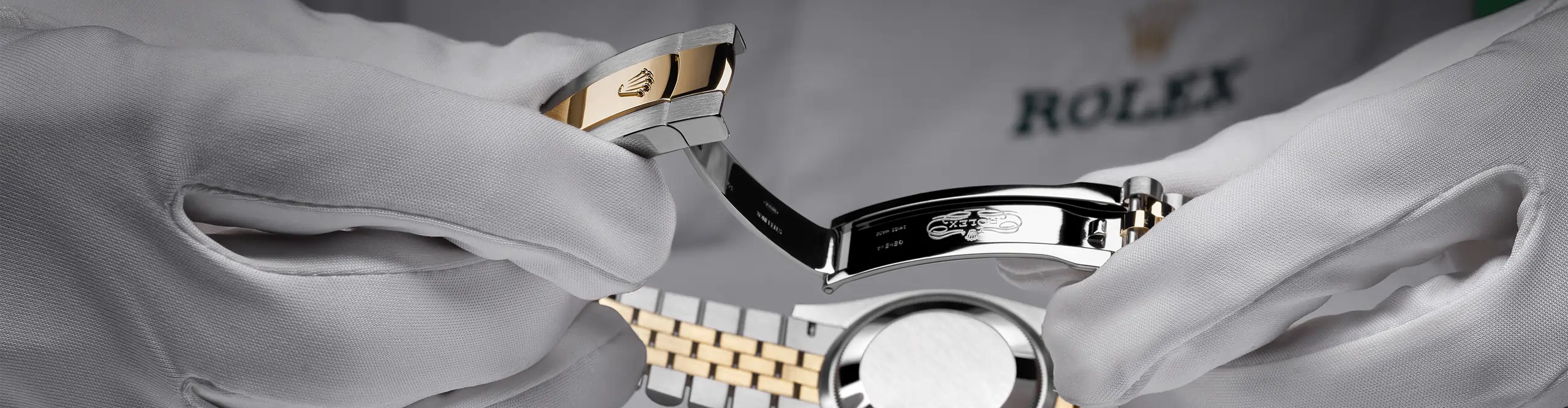 Gloved hands inspecting a Rolex case and bracelet during servicing. - Chang Ein Hong