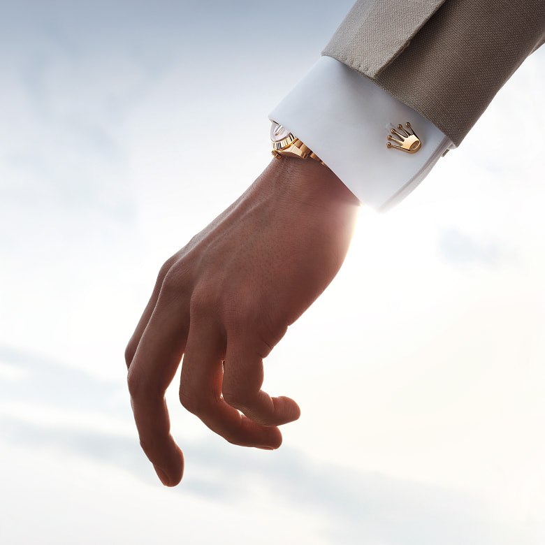 Rolex crown cufflink worn on a shirt cuff - Chang Ein Hong