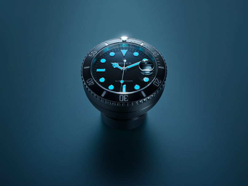 Rolex desk clock that revisits the design of the Submariner Date. Its Chromalight display emits an intense blue glow in the dark. - Chang Ein Hong