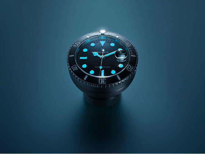 Rolex desk clock that revisits the design of the Submariner Date. Its Chromalight display emits an intense blue glow in the dark. - Chang Ein Hong