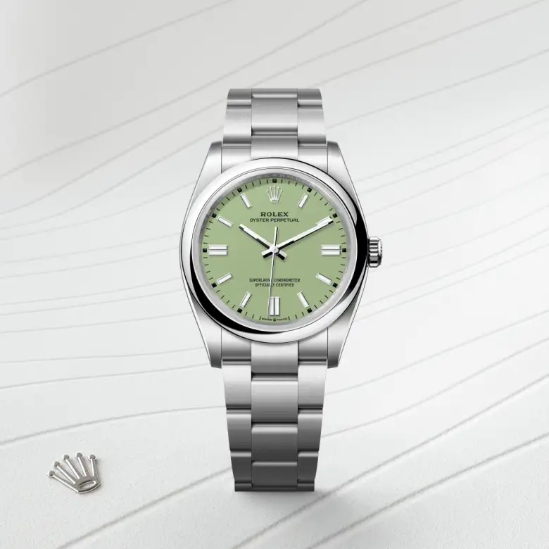 The The Rolex Oyster Perpetual 36 in Oystersteel shown against a muted, elegant background. - Chang Ein Hong