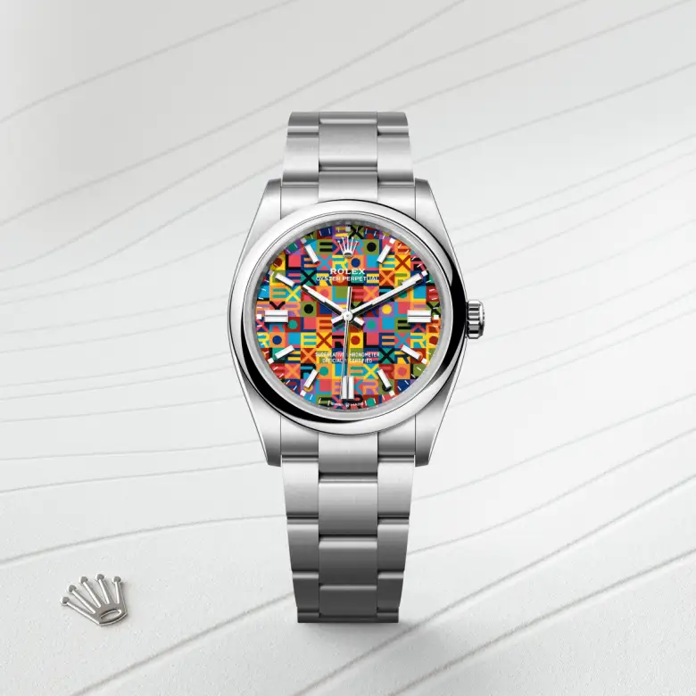 The The Rolex Oyster Perpetual 36 in Oystersteel shown against a muted, elegant background. - Chang Ein Hong