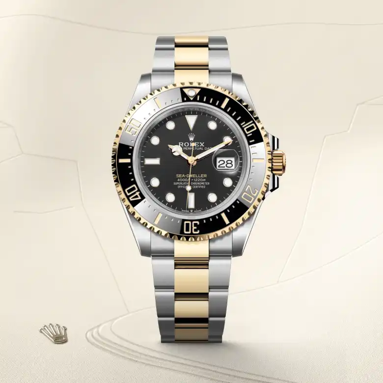 The The Rolex Sea-Dweller in Oystersteel and yellow gold shown against a muted, elegant background. - Chang Ein Hong