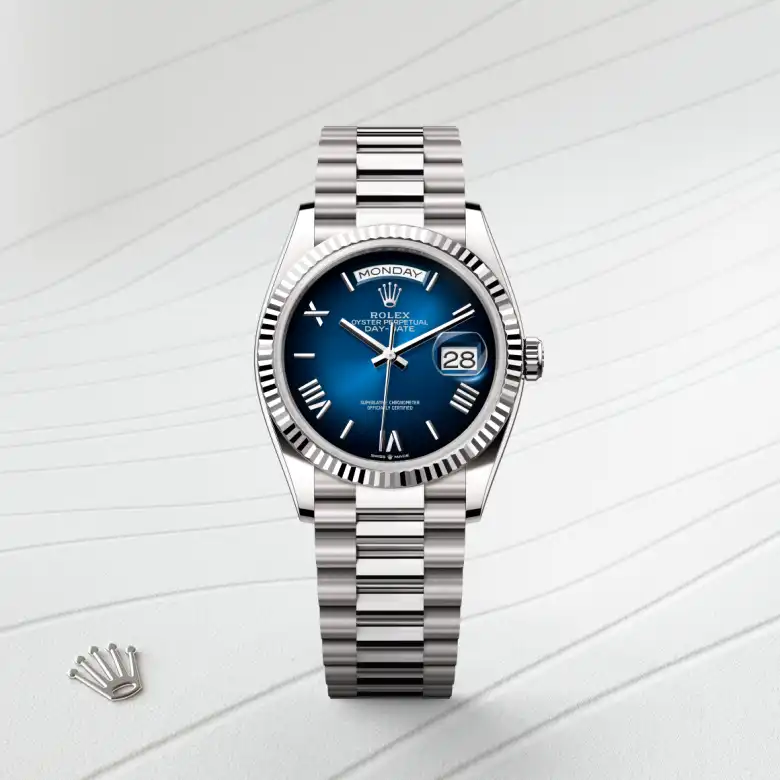 The The Rolex Day-Date 36 in white gold shown against a muted, elegant background. - Chang Ein Hong