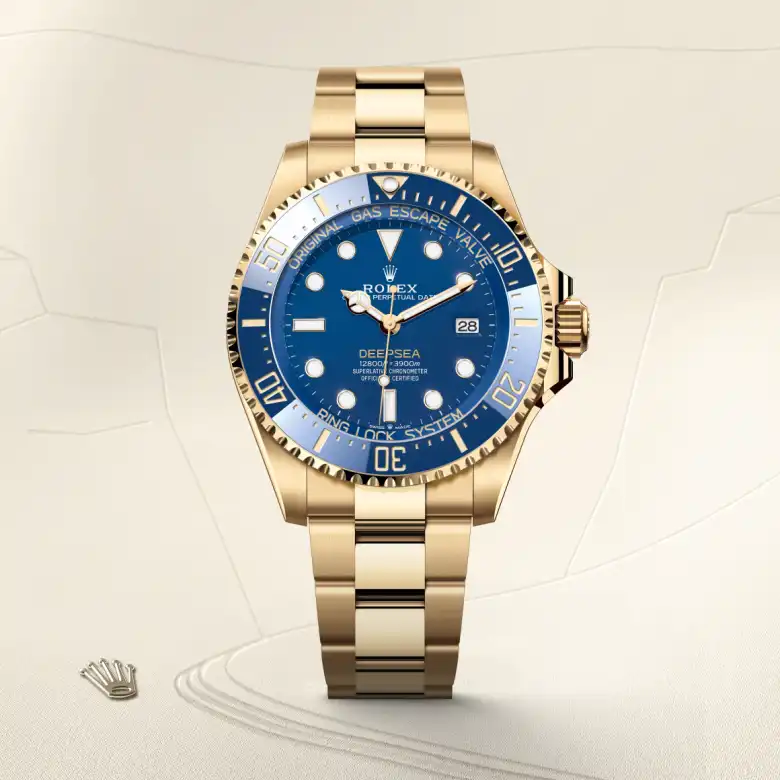 The The Rolex Deepsea in yellow gold shown against a muted, elegant background. - Chang Ein Hong