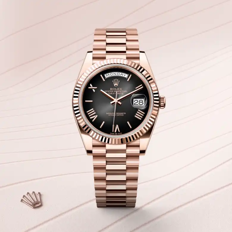The The Rolex Day-Date 40 in Everose gold shown against a muted, elegant background. - Chang Ein Hong
