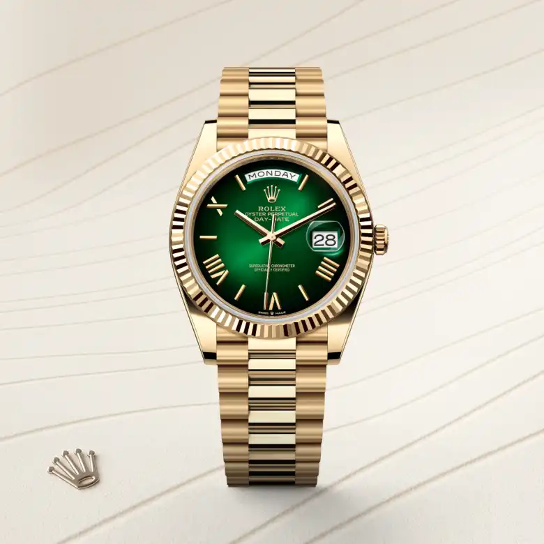 The The Rolex Day-Date 40 in yellow gold shown against a muted, elegant background. - Chang Ein Hong