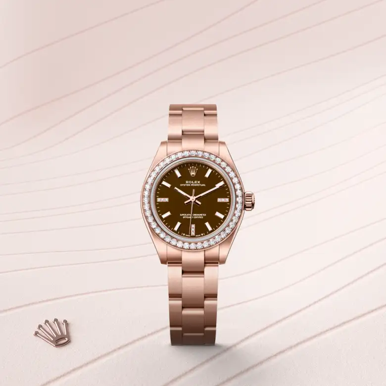 The The Rolex Oyster Perpetual 28 in Everose gold and diamonds shown against a muted, elegant background. - Chang Ein Hong