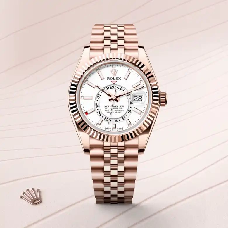 The The Rolex Sky-Dweller in Everose gold shown against a muted, elegant background. - Chang Ein Hong