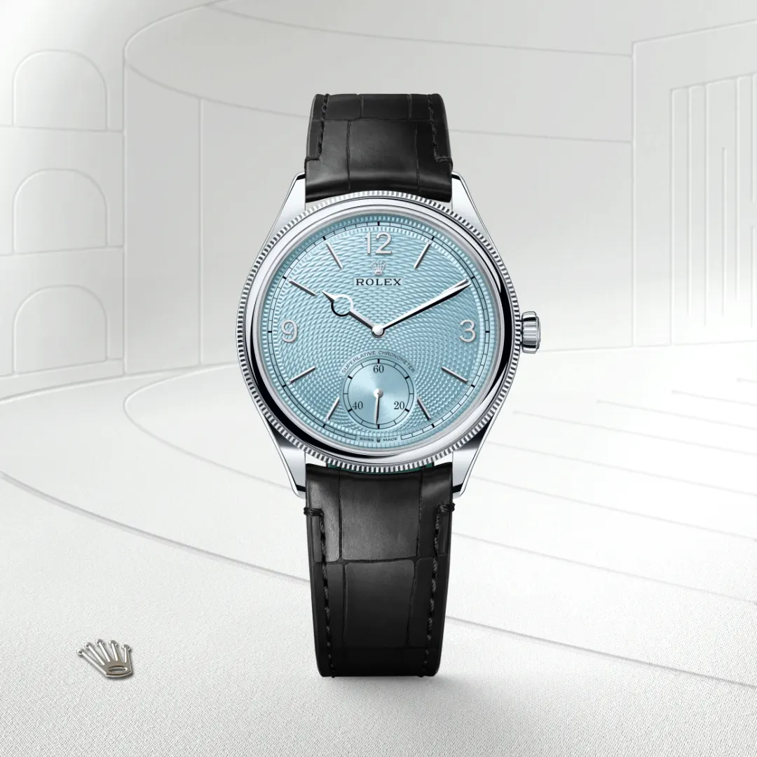 The The Rolex 1908 in platinum, polished finish shown against a muted, elegant background. - Chang Ein Hong