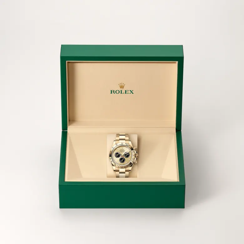 The The Rolex Cosmograph Daytona in yellow gold in the Rolex presentation box. - Chang Ein Hong