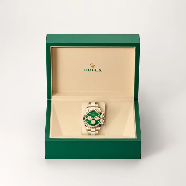 The The Rolex Cosmograph Daytona in yellow gold in the Rolex presentation box. - Chang Ein Hong